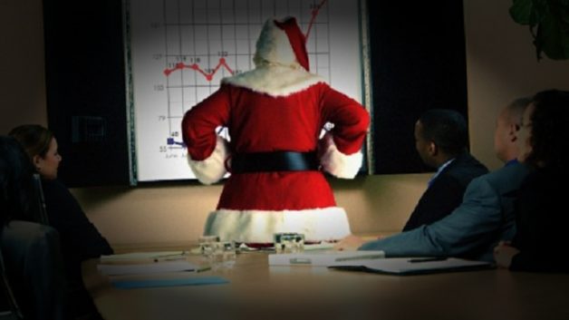 Papai Noel observa gráfico de alta