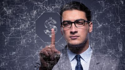 businessman-pressing-virtual-button-dollar