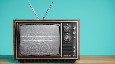 An,Old,Tv,With,A,Monochrome,Kinescope,On,Wooden,Table.