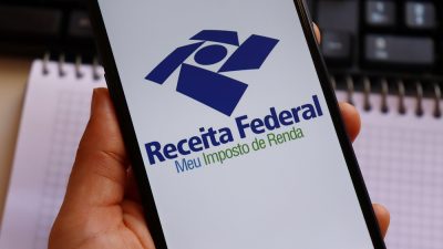 Bahia,,Brazil,-,February,25,,2021:,Hand,Holding,Smartphone,With