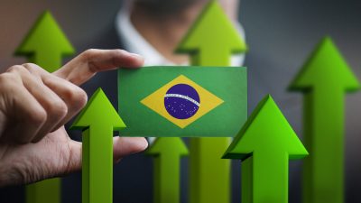 Nation,Growth,Concept,,Green,Up,Arrows,-,Businessman,Holding,Card