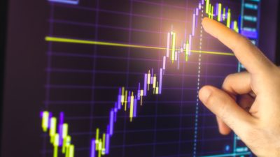 Hand,Pointing,To,B3,(former,Ibovespa),Index,Chart,With,Positive