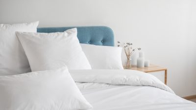 White,Pillows,,Duvet,And,Duvet,Case,On,A,Blue,Bed.