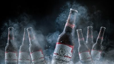 Close,Up,Of,Seven,Bottles,Of,American,Beer,Budweister,On