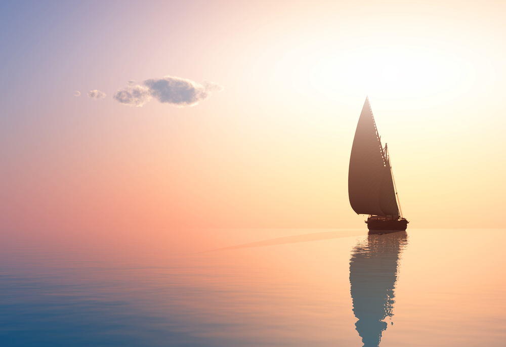 Barco na água com o sol se pondo ao fundo | Ibovespa