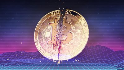 Moeda de bitcoin partida ao meio representa queda no mercado de criptomoedas