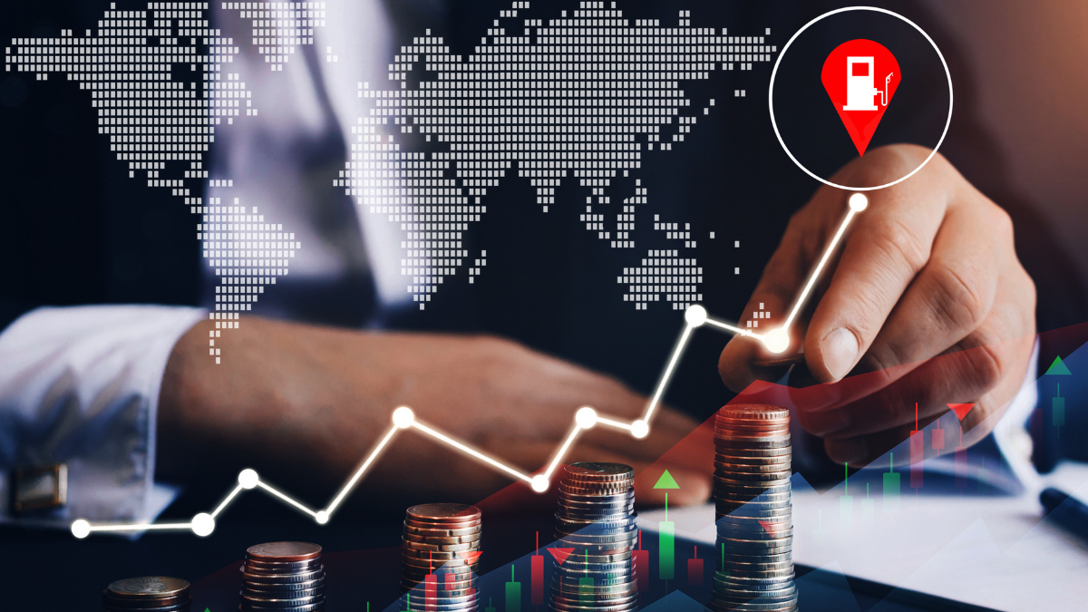 Um trader aponta com o dedo para cima de um gráfico com o preço do petróleo nas alturas; commodities em alta