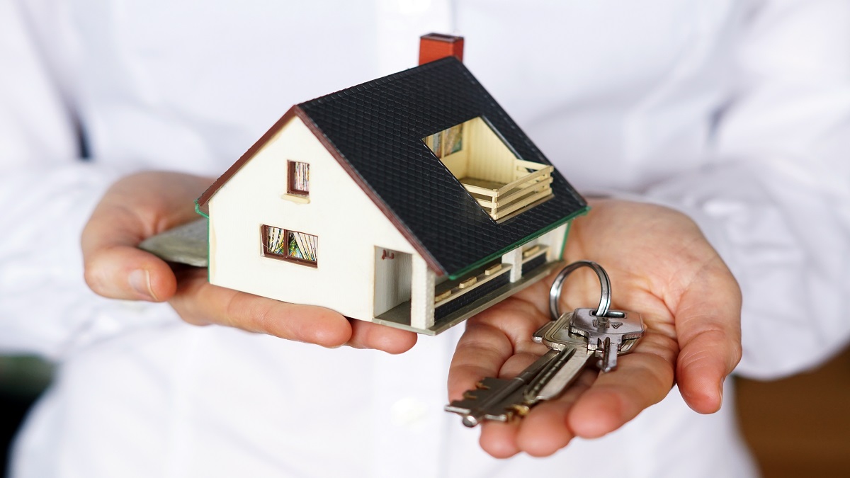Closeup shot of a person thinking of buying or selling a house