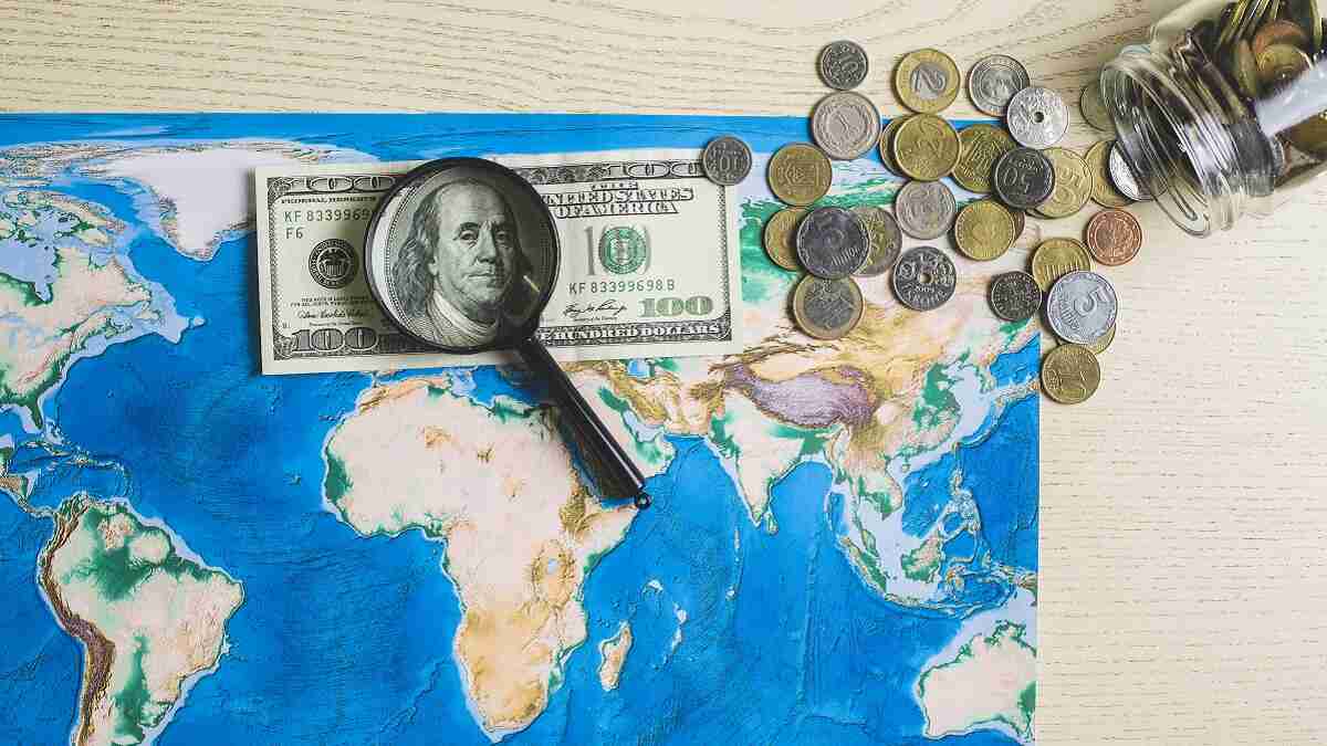 map-world-with-money-magnifying-glass (1)