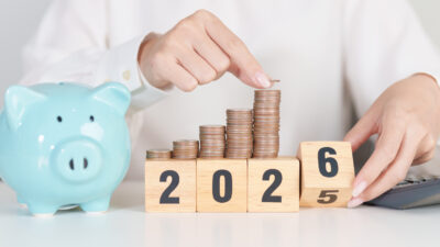 2025 end year to Happy New Year 2026 with piggy bank. Resolution, Goals, Plan, Action, Money Saving, Retirement fund, Pension, Investment and Financial concepts
