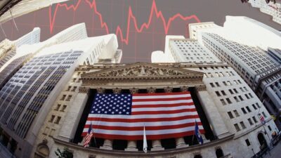 Wall Street diante de um gráfico vermelho de queda