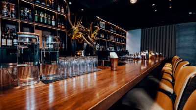 Modern empty night bar, wide angle near bar counter.