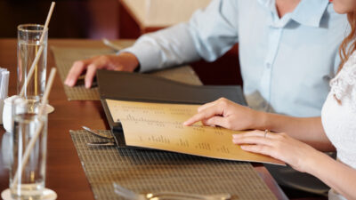 Woman pointing at menu