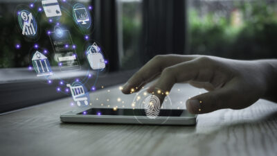 Businessman using smartphone and fingerprint scanning unlock and online banking and icon on network connection