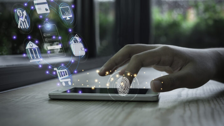 Businessman using smartphone and fingerprint scanning unlock and online banking and icon on network connection