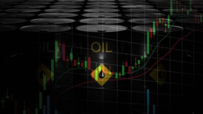 Barris de petróleo escrito OIL no centro em uma montagem com um gráfico de ações por cima