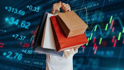 Gráfico de ações e sacolas de compras para representar empresas do varejo