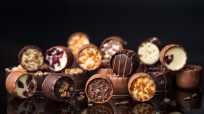 Luxurios chocolate prailne candies with nuts and dried fruits