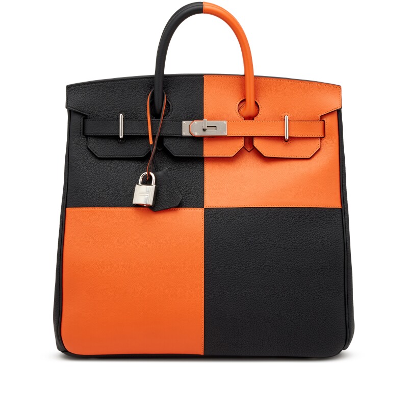 Bolsa de luxo preta com laranja da Hermes