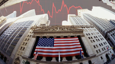 Wall Street diante de um gráfico vermelho de queda