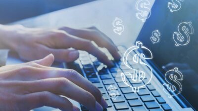 Computador e cifrão para representar empreendedorismo e o trabalho com CNPJ